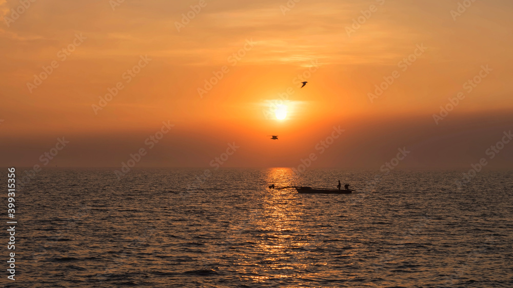 Silhouette fisherman and flying birds at sunset, Bang Pu