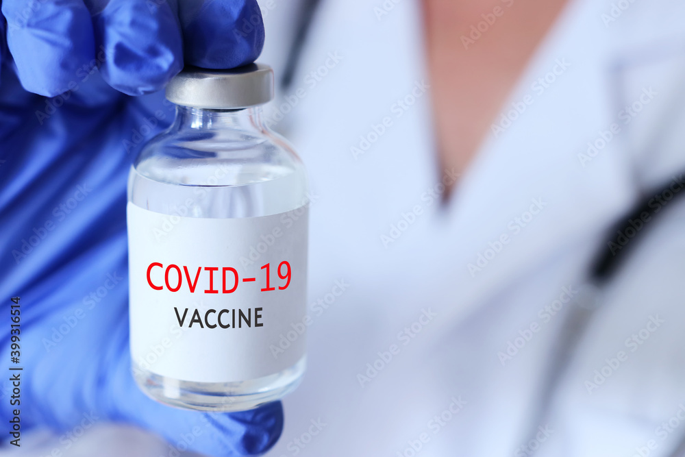 Doctor or nurse holding covid 19 vaccine. Healthcare and Medical concept Doctor or nurse holding covid 19 vaccine. Healthcare and Medical concept