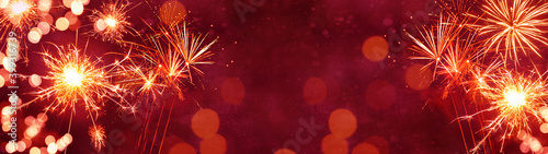 Silvester Party Festival New Year 2024 Fireworks background panorama banner long - Firework on red texture with bokeh light and space for text	