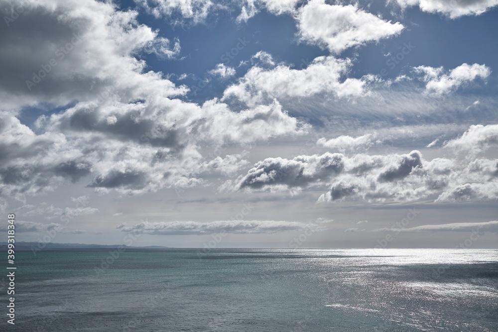 Distant horizon at the seas, endless ocean with clouds