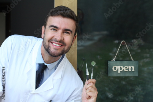 Dentist showing traditional metallic tools