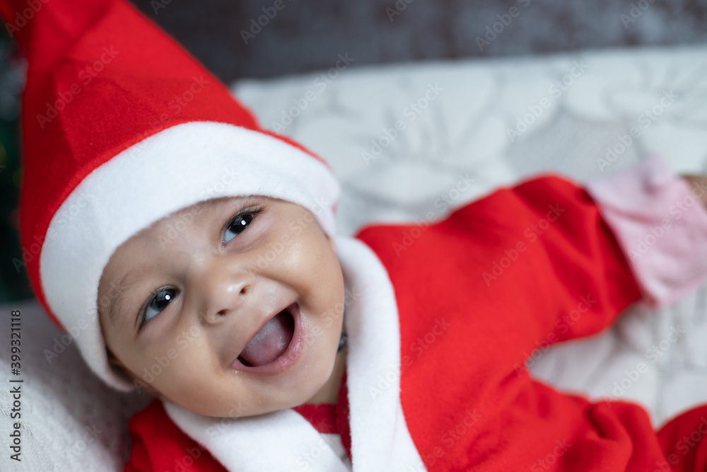Portrait of Baby smiling in Santa costume Portrait of Baby smiling in Santa costume