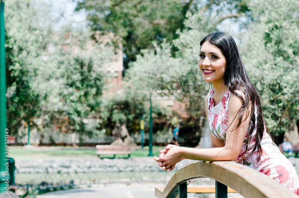 Spring fashion young woman portrait outdoors with trees in background. Beauty Romantic Woman in Spring fashion young woman portrait outdoors with trees in background. Beauty Romantic Woman in