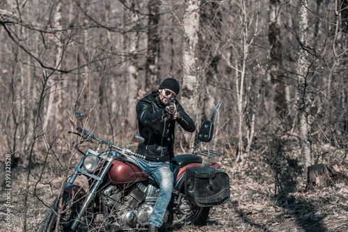 Biker portrait. Photo with a motorcycle
