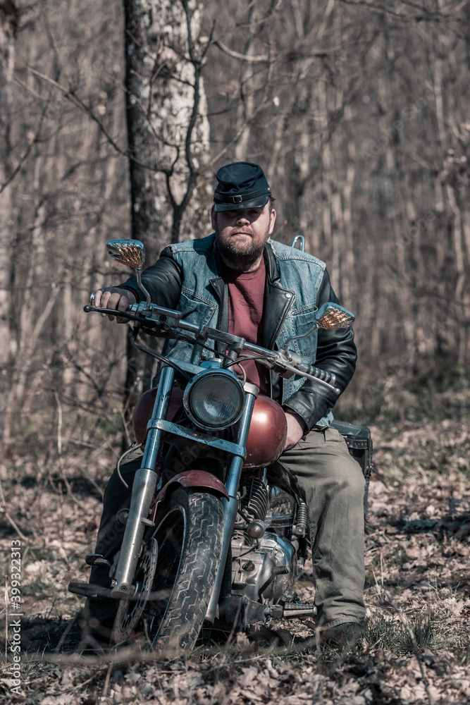 Biker portrait. Photo with a motorcycle