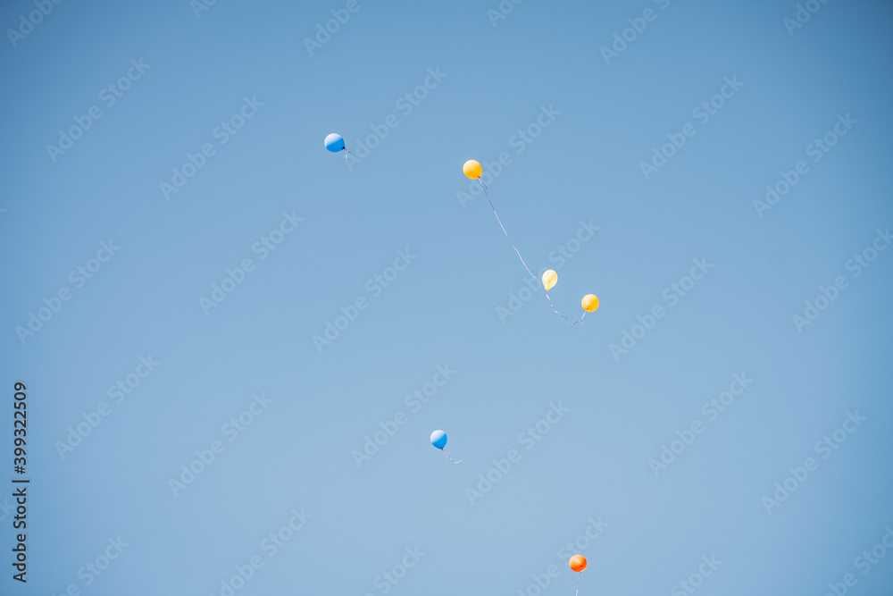 colorful balloons flying in the blue sky, colorful balloons flying in the blue sky,