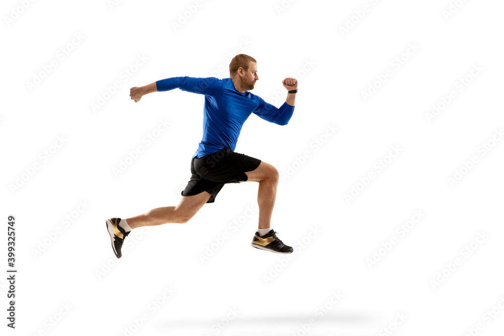 Win. Caucasian professional jogger, runner training isolated on white studio background. Muscular, sportive man, emotional. Concept of action, motion, youth, healthy lifestyle. Copyspace for ad.