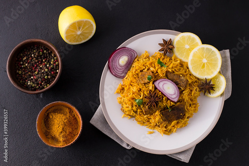 Biryani with chicken. Traditional Indian dish of rice and chicken, with spices and lemon.