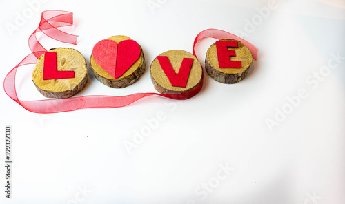 Valentine, handmade heart on wood with ribbons. isolated white background 