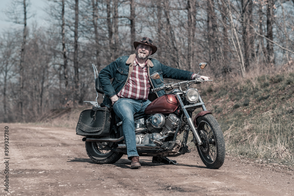 Fototapeta premium Biker portrait. Photo with a motorcycle