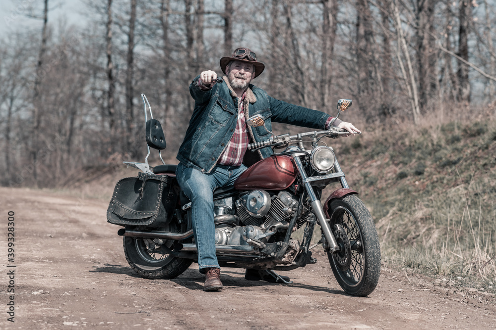 Biker portrait. Photo with a motorcycle