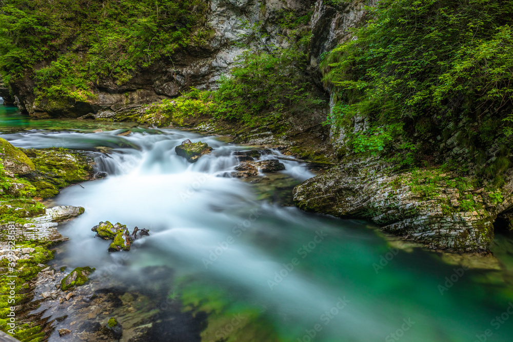Breathtaking view over colorful Radovna river in Vintgar Gorge, Slovenia. Long exposure. Breathtaking view over colorful Radovna river in Vintgar Gorge, Slovenia. Long exposure.