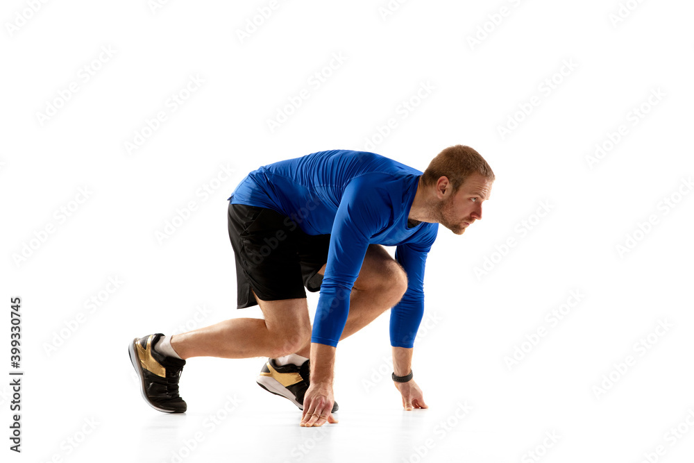 Energy. Caucasian professional jogger, runner training isolated on white studio background. Muscular, sportive man, emotional. Concept of action, motion, youth, healthy lifestyle. Copyspace for ad. Energy. Caucasian professional jogger, runner training isolated on white studio background. Muscular, sportive man, emotional. Concept of action, motion, youth, healthy lifestyle. Copyspace for ad.