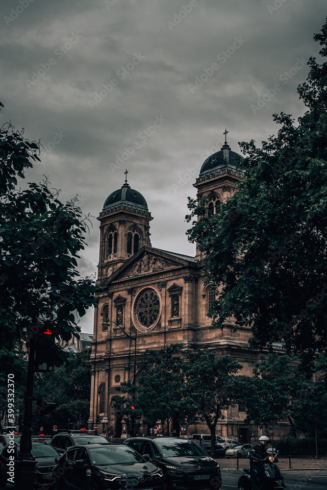 A close up of a street in front of a church