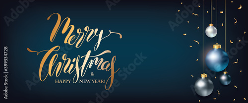 Merry Christmas and New Year Holiday Banner. Elegant Blue Christmas Background with Xmas balls decoration in gold confetti with Christmas Lettering greeting text photo