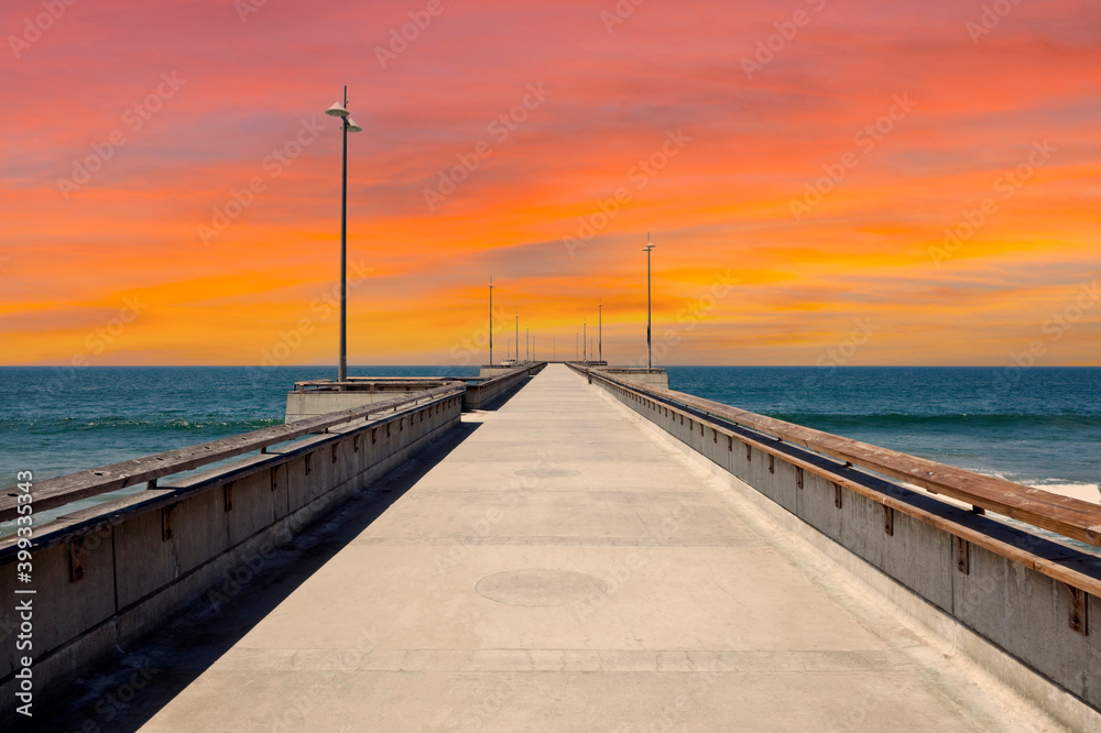 View of Venice Pier with sunset sky in Los Angeles, California.