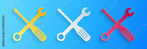 Paper cut Spanner and screwdriver tools icon isolated on blue background. Service tool symbol. Paper art style. Vector.