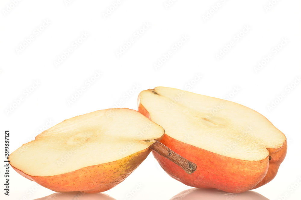 Two halves of organic red pear, close-up, isolated on white. Two halves of organic red pear, close-up, isolated on white.