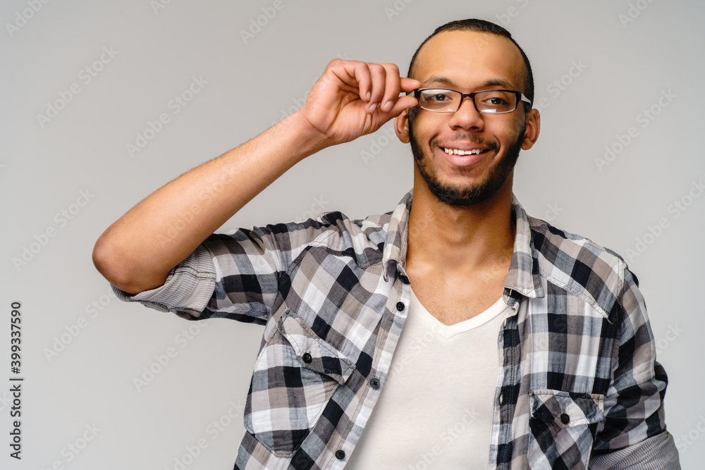Portrait of a young african american over light grey background Portrait of a young african american over light grey background
