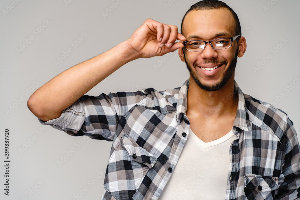 Portrait of a young african american over light grey background Portrait of a young african american over light grey background