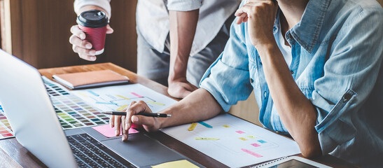 Team of Creative Web/Graphic Designer planning, drawing website ux app for mobile phone application and development template layout, process to developing prototype wireframe, User experience concept