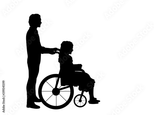 Silhouettes of man walking child girl in wheelchair