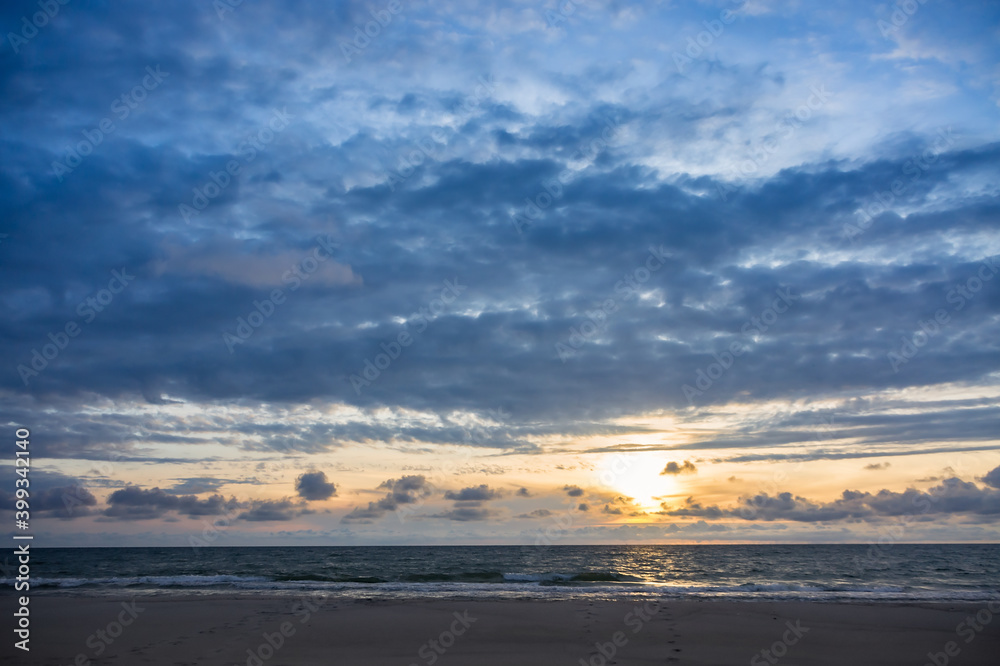 Sunset over the sea. Reflection of sunlight in the sea waves. The sky in the sunset rays. Baltic Sea. Sunset over the sea. Reflection of sunlight in the sea waves. The sky in the sunset rays. Baltic Sea.