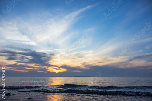 Sunset over the sea. Reflection of sunlight in the sea waves. The sky in the sunset rays. Russia Baltic Sea. © SeagullNady