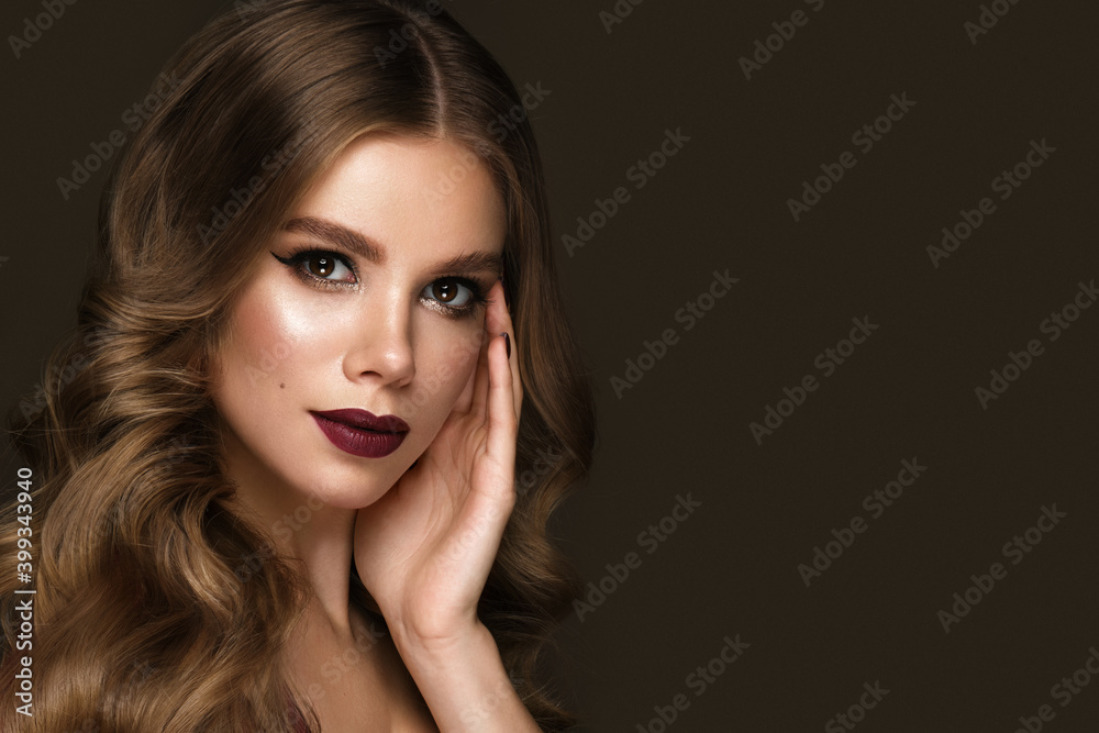 Beautiful sexy woman with classic make-up, fashion hair and red lips. Beauty face. Photo taken in the studio. Beautiful sexy woman with classic make-up, fashion hair and red lips. Beauty face. Photo taken in the studio.