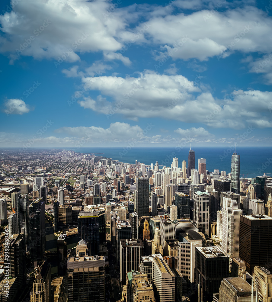 Chicago, Illinois USA aerial skyline with Lake Michigan on the background. Sunny day, blue sky with clouds 