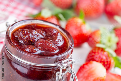 Bowl of strawberry jam isol...