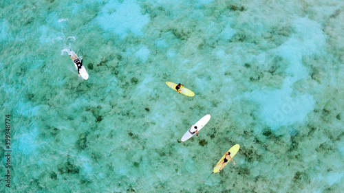 surfers from above chillin on boards