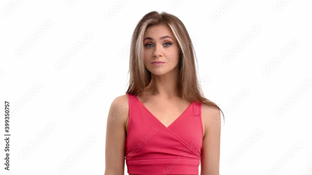 Portrait of unsure woman demonstrate gesture can't help anything isolated. Medium shot on RED camera Portrait of unsure woman demonstrate gesture can't help anything isolated. Medium shot on RED camera