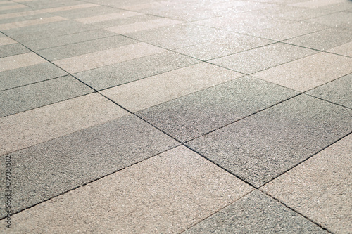 gray color paving slabs in the city, pedestrian street