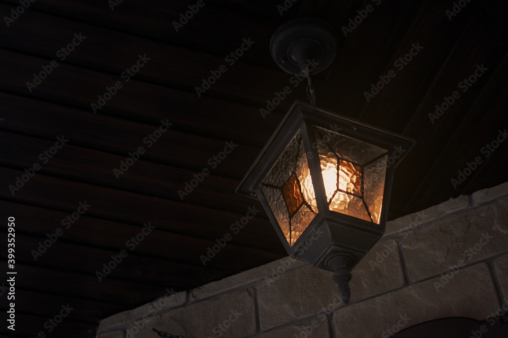 Mystic Street Lamp Mounted On Wood Ceiling Roof. Glowing Mosaic Lantern In Dark Night. Rhombus Ornament Sconce Wall-Mounted.