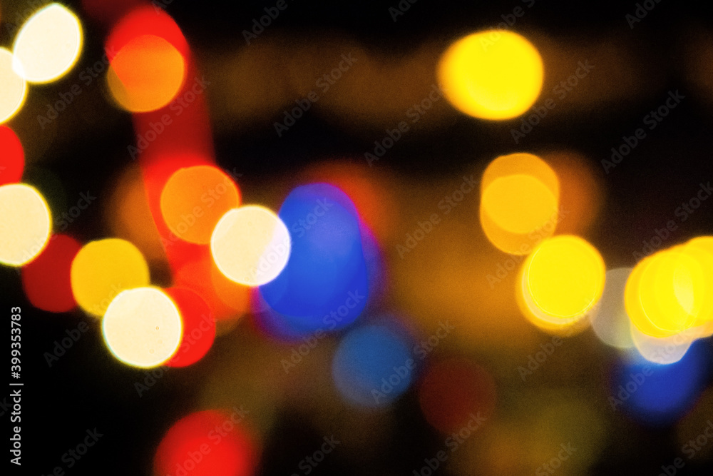 winter holidays background. garlands on the street with bokeh effect