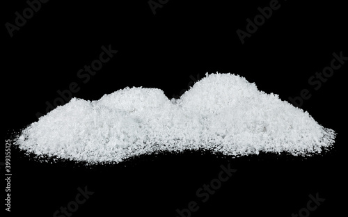 Pile of fluffy white snow isolated on a black background. Snowdrifts. Snow hills.