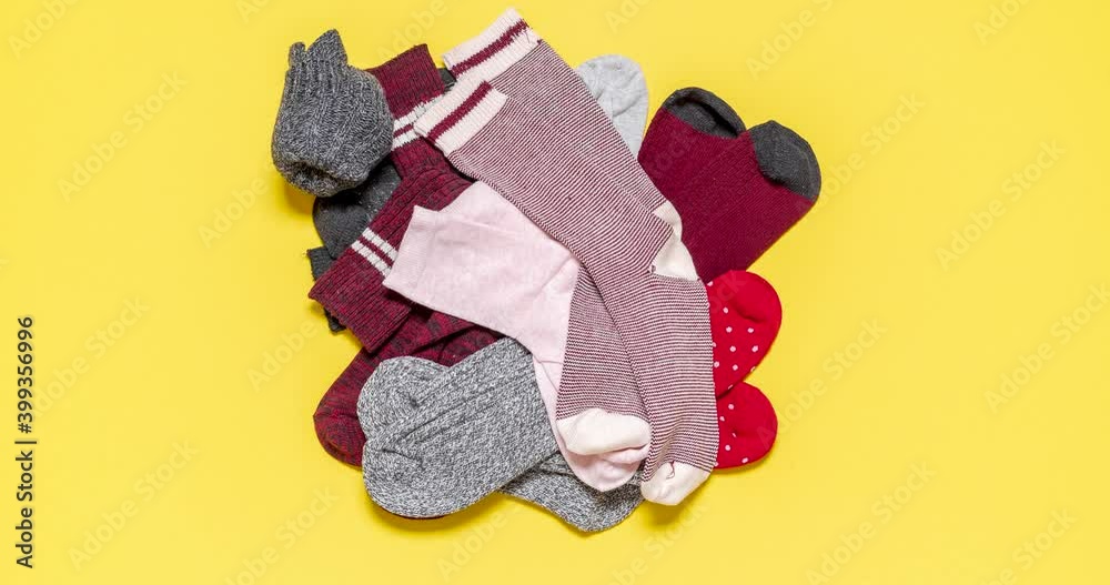 Socks in a drawer stop motion. Top view with a pile of socks.
