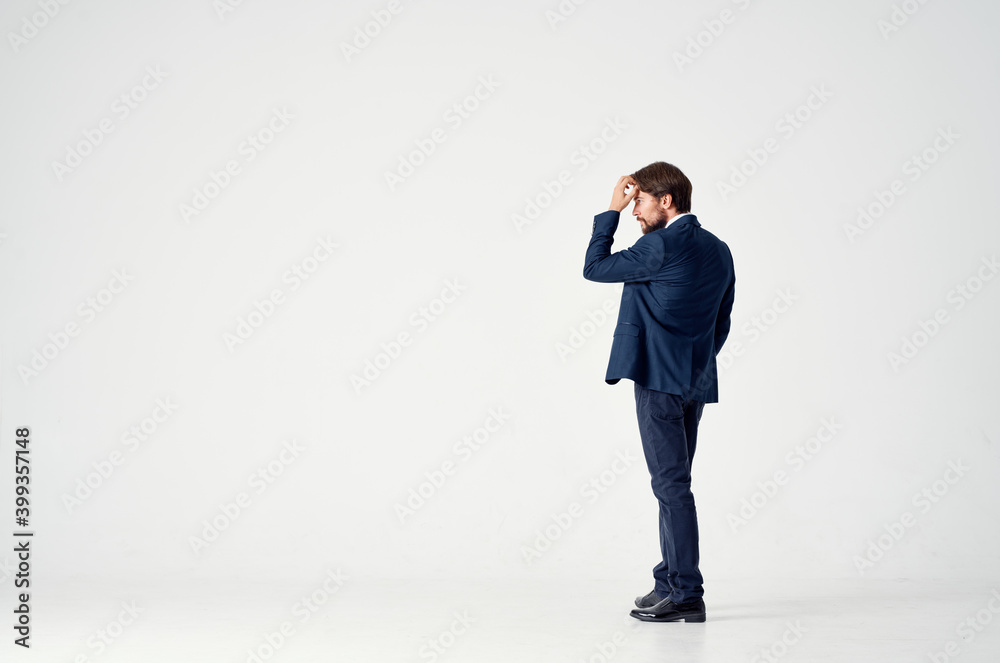 business man on a light background in a classic suit Copy Space back view business man on a light background in a classic suit Copy Space back view