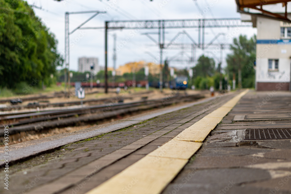 An old railway depot, trains in the background with all the infrastructure.