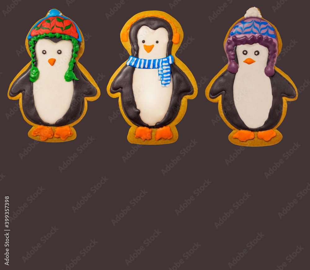 Fototapeta premium Gingerbread cookie of cute penguin on white background isolated. Traditional Christmas food. Christmas and New Year holiday concept..Hand painted. Comfort food. Christmas treat.