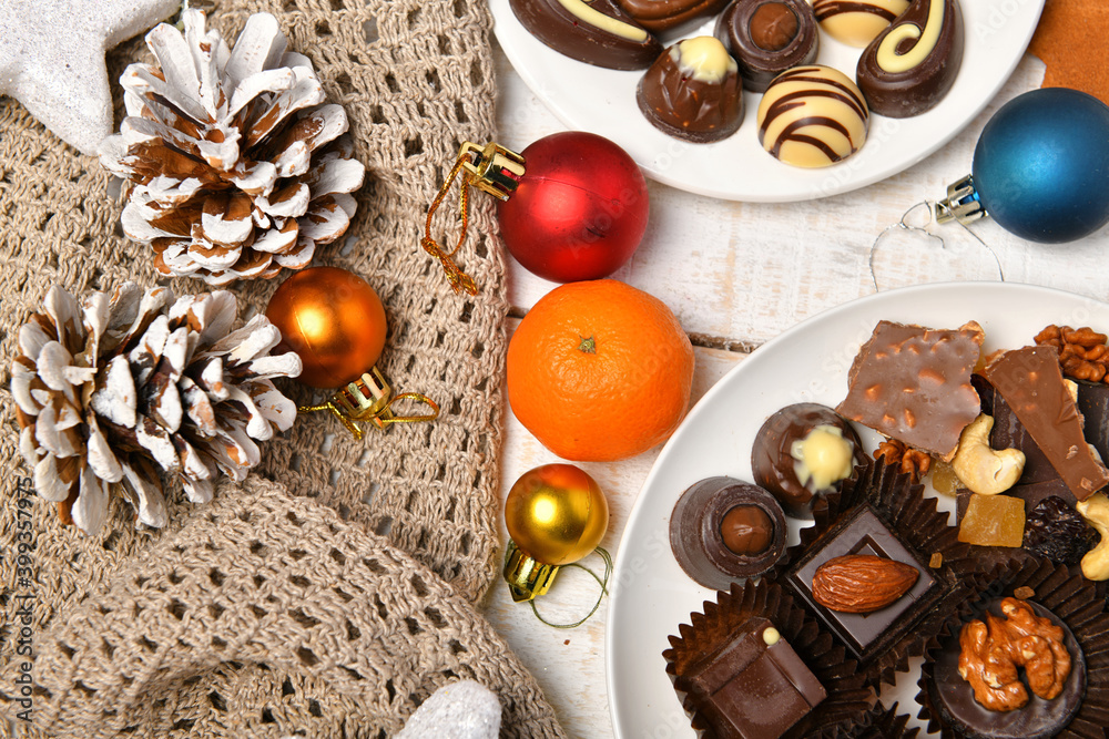 sweet food top view background for merry christmas or new year holiday decoration - chocolate candies, tangerines, cookies on white wood sweet food top view background for merry christmas or new year holiday decoration - chocolate candies, tangerines, cookies on white wood