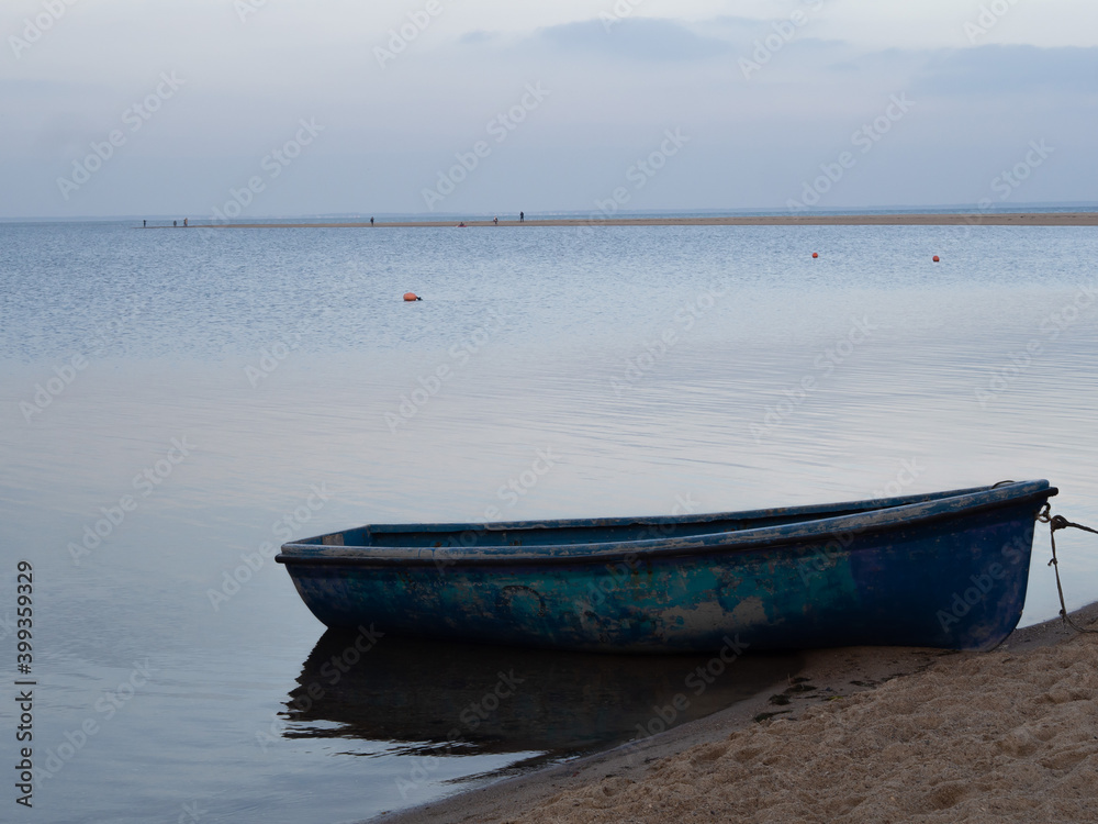 Beautiful quiet winter shore of the Baltic Sea with moored cutters and boats.. Beautiful quiet winter shore of the Baltic Sea with moored cutters and boats..