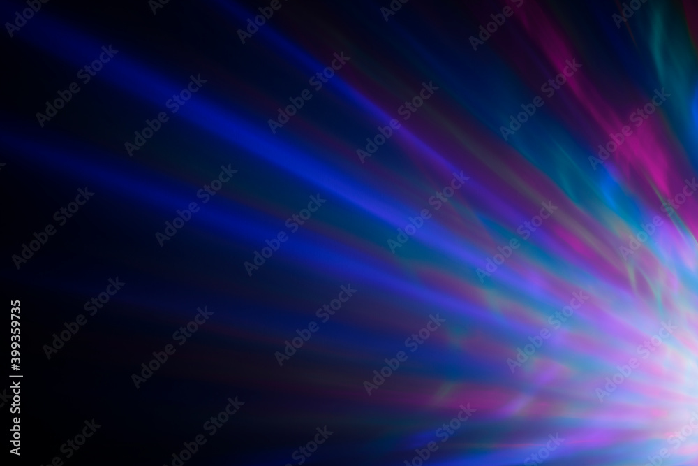 Colorful rays of light or light beams at dark. Abstract high resolution background.