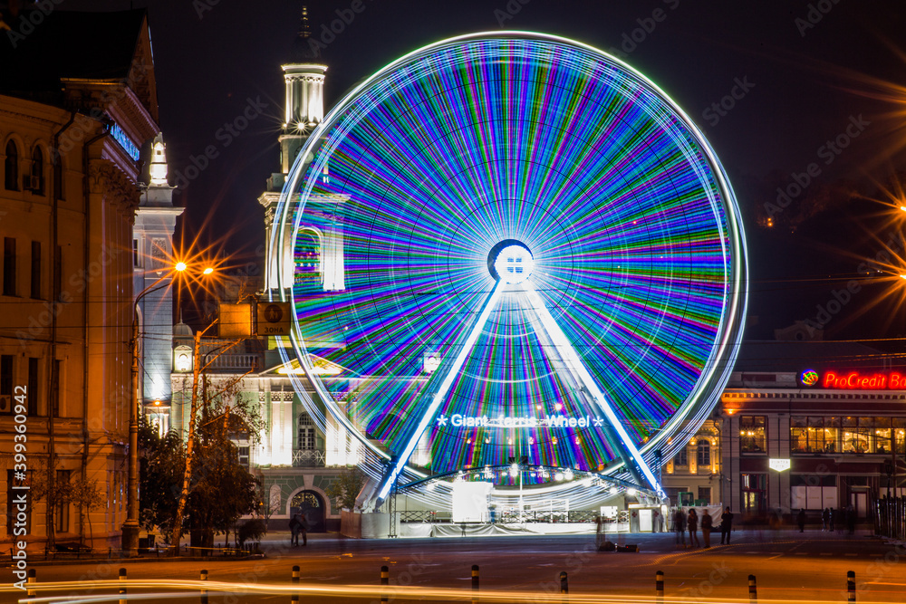 Giant ferris wheel in the center of the city in the night Giant ferris wheel in the center of the city in the night