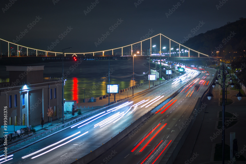 Kyiv, Ukraine 11.11.2020: Long exposure view of the road and bridge with illumination at night kyiv Kyiv, Ukraine 11.11.2020: Long exposure view of the road and bridge with illumination at night kyiv