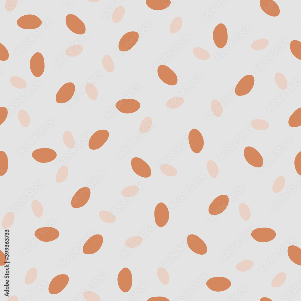 Granola print - healthy food. Geometric seamless pattern with orange and beige ovals on a grey isolated background. Graphic dots, peas, uneven edges. Great for fabric, wallpaper, textile, wrapping.