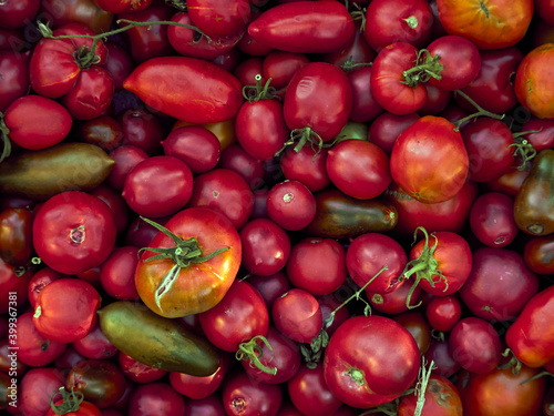 Background with ripe red tomatoes..