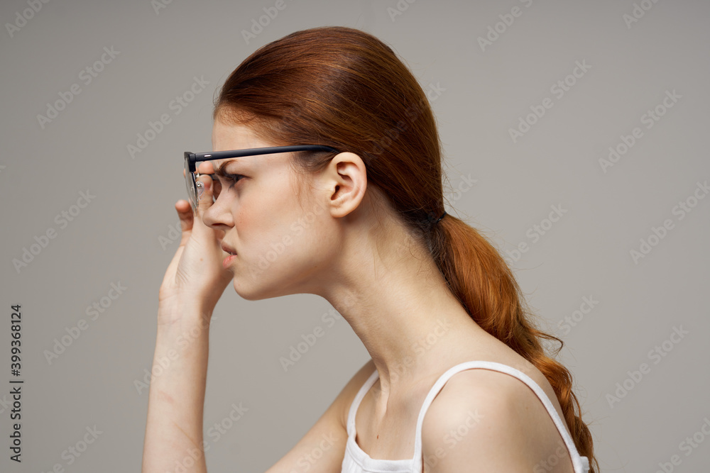 red-haired woman with glasses vision problems fatigue negative red-haired woman with glasses vision problems fatigue negative