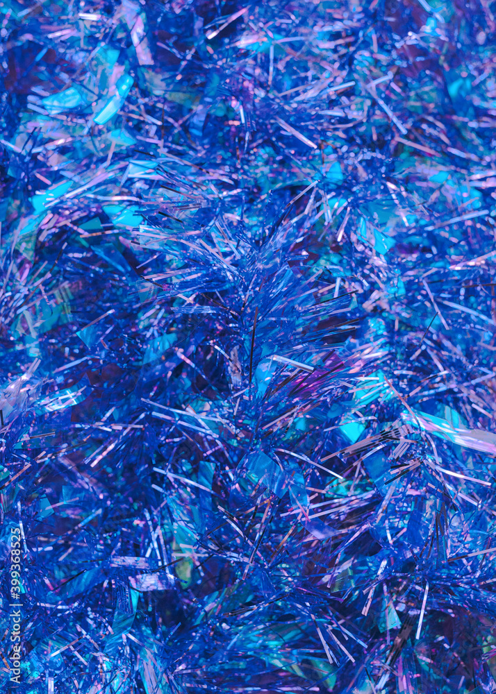 Blue shiny tinsel texture Close up photo Blue sparkle decorative frippery Christmas backdrop Blue shiny tinsel texture Close up photo Blue sparkle decorative frippery Christmas backdrop